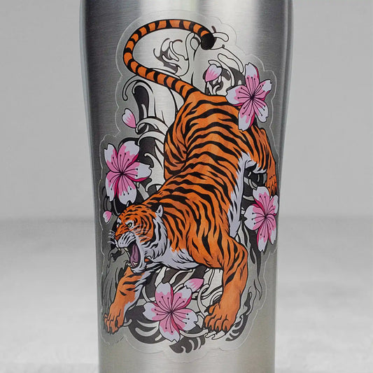 Clear sticker with white ink allows for a variety of creative uses for branding and more. Clear tiger with floral design sticker, applied to a stainless steel tumbler that allows the cup material to show through.